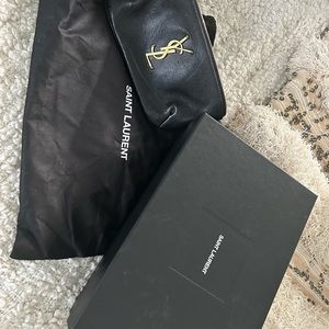 YSL belt bag. Used sparingly. Small amount of nail glue in the interior pocket.